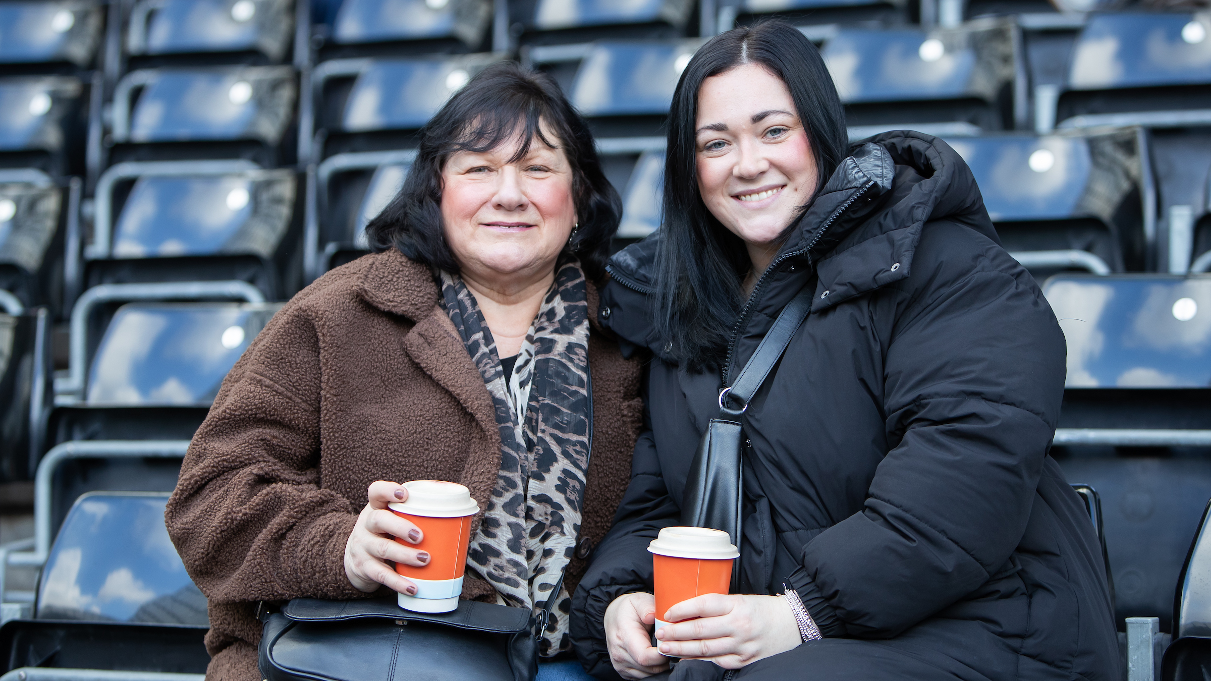 Two supporters at the Swansea.com Stadium