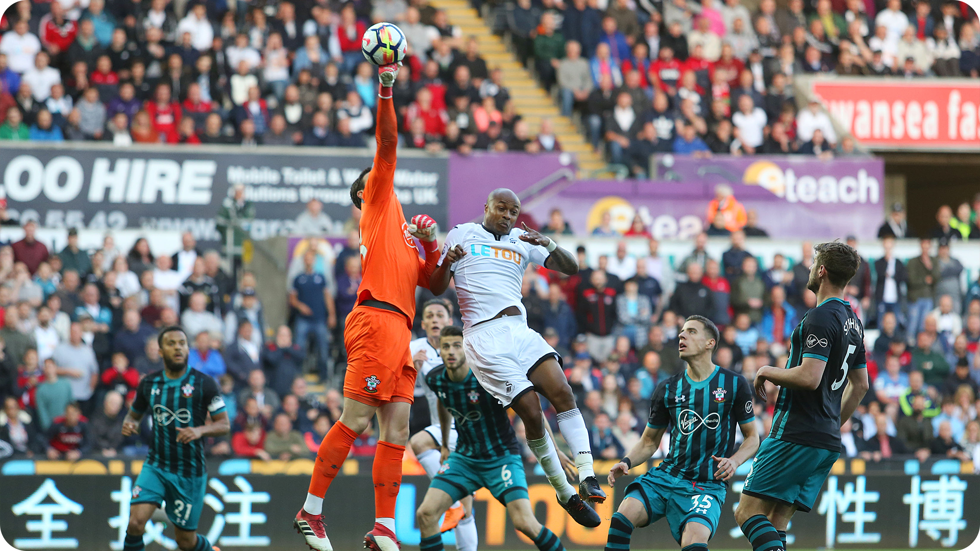 Andre Ayew in an aerial duel