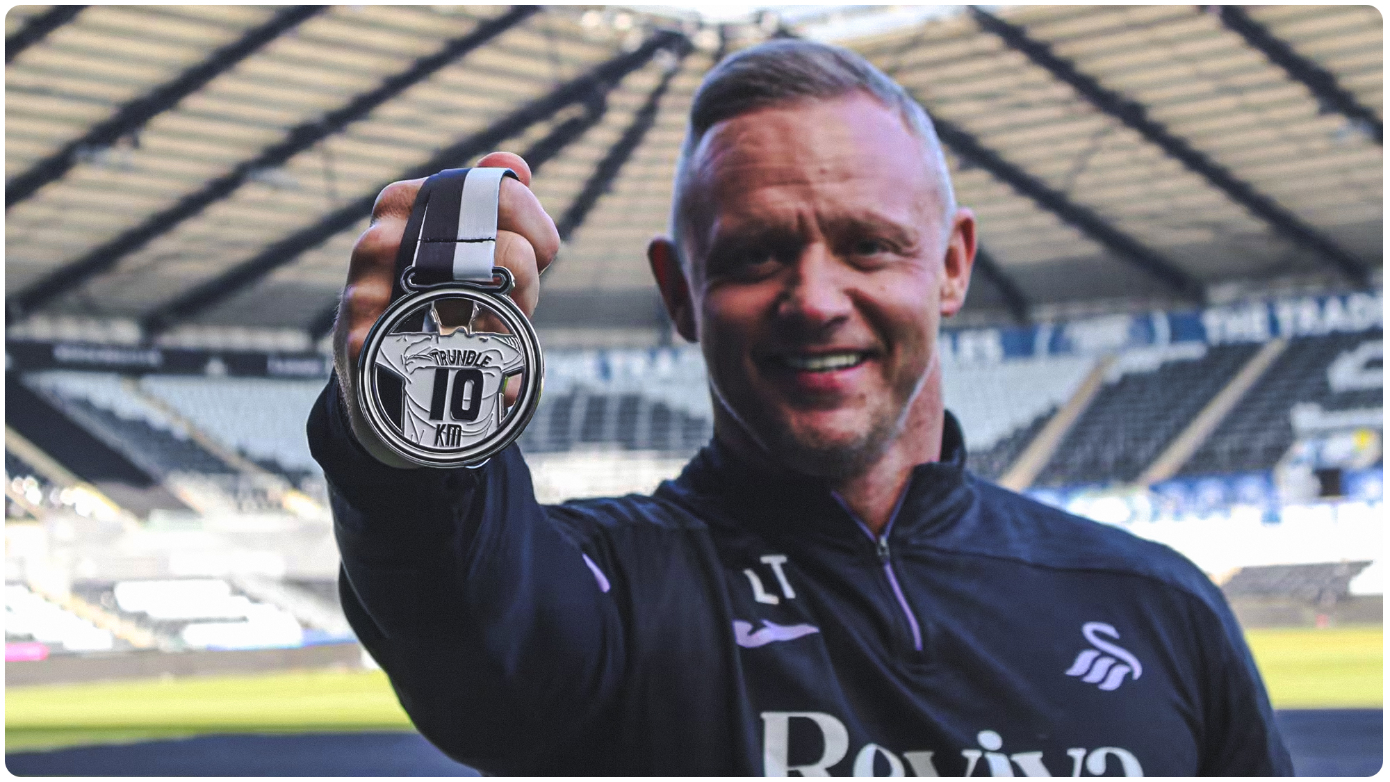 Image of Lee Trundle with the Special Edition Medal available for Successful Participants