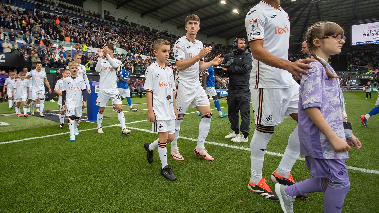 mascot walking out into Swansea.com stadium