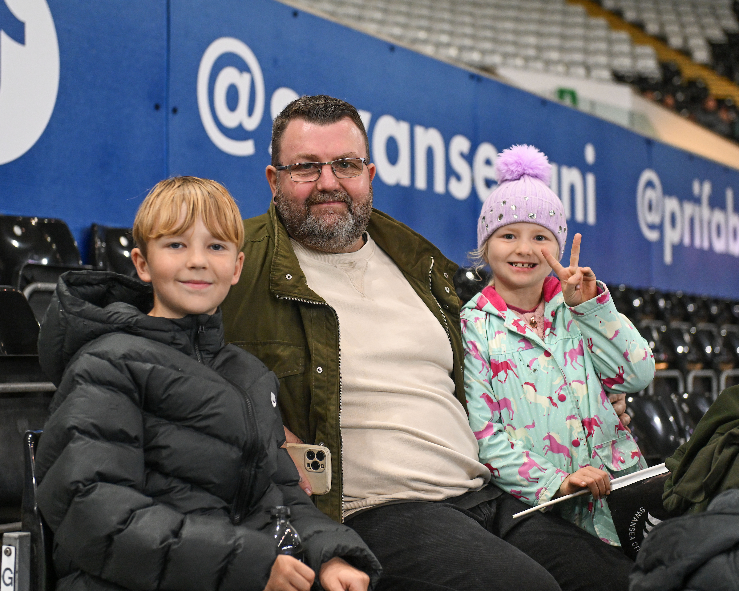 A family of Swansea supporters at the home game against QPR.
