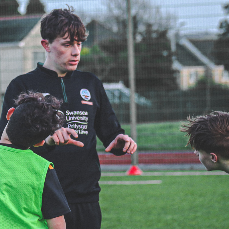 Photograph of the Swansea City AFC Foundation staff during a Welsh Language Kicks session