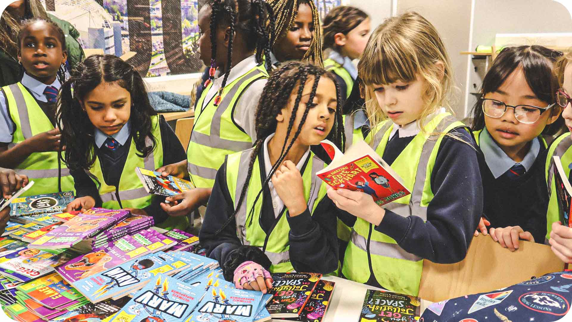 Photograph of pupils looking through the selection of free books.