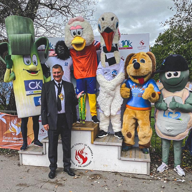 Mascots Celebrate on the Podium