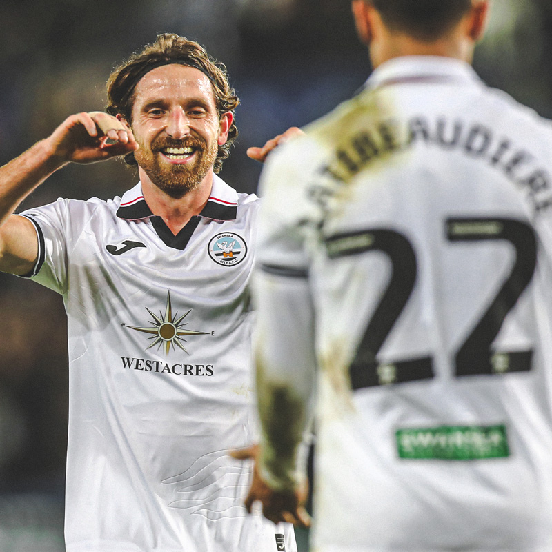 Joe Allen celebrating with Joel Latibeaudiere