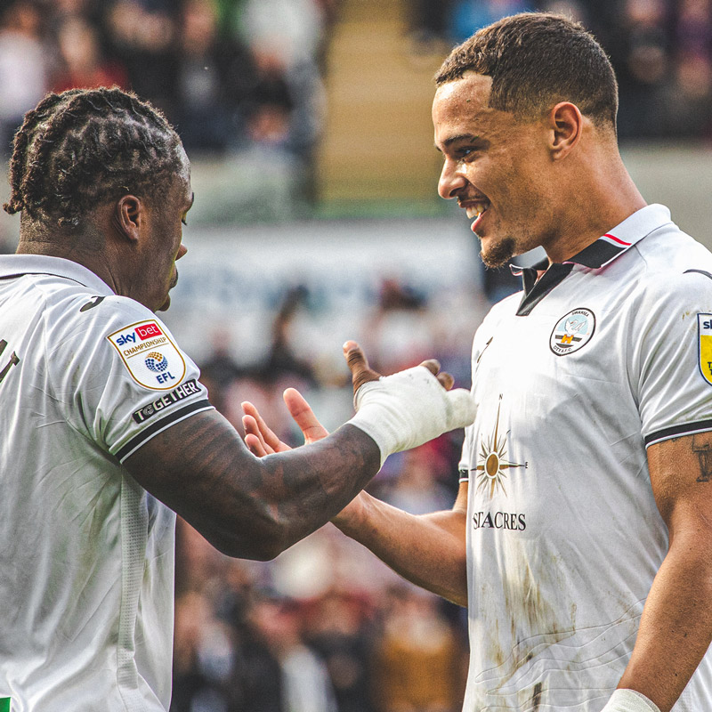 Photograph of Latibeaudiere celebrating with Michael Obafemi