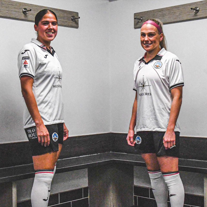 Photograph of the Swans Ladies players sporting black shorts
