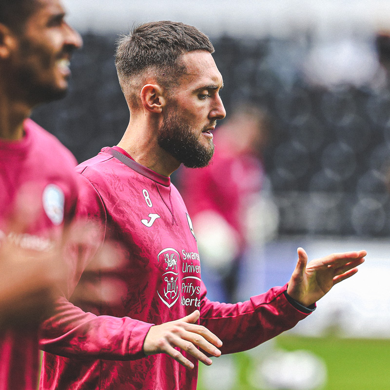 Matt Grimes' warming up with team mates