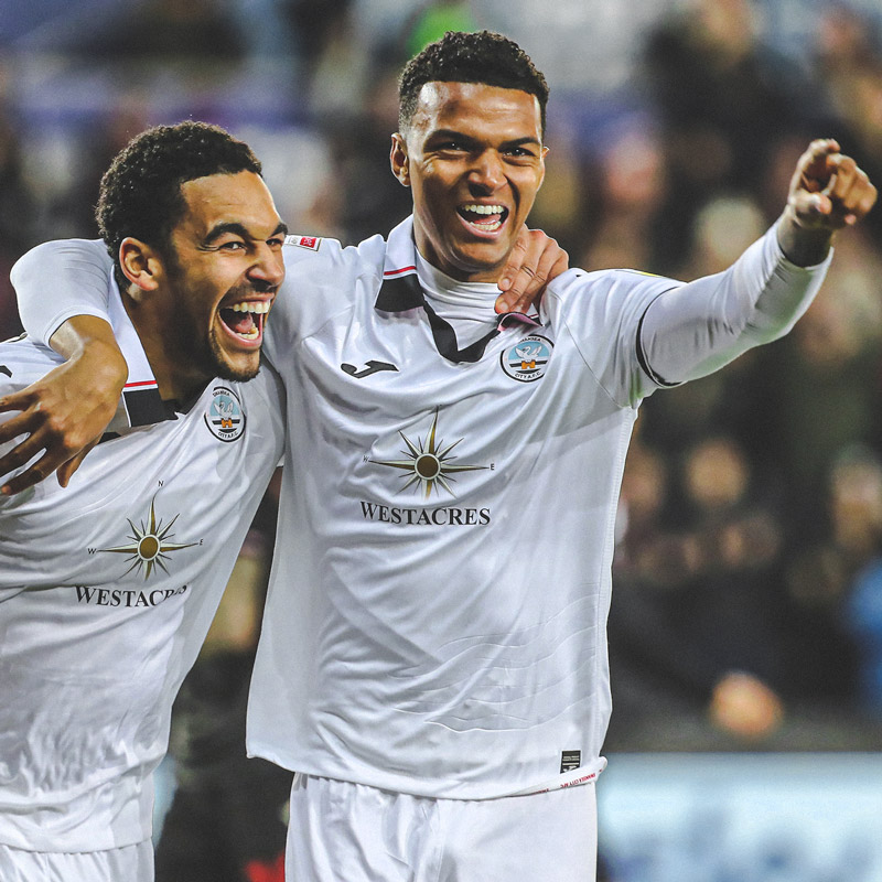 Photograph of Whittaker celebrating scoring against Stoke City