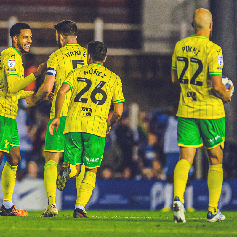 Norwich City squad celebrating scoring at Carrow Road