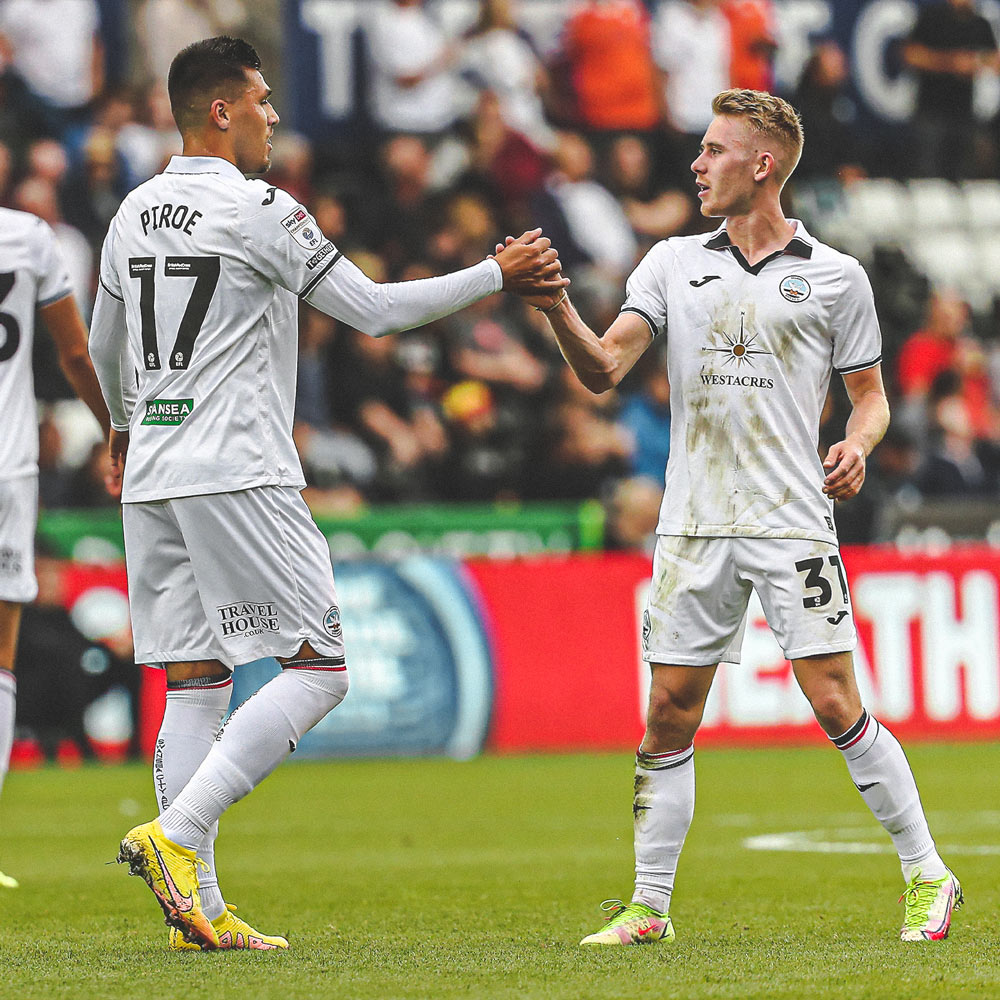 Photograph of Ollie Cooper celebrating with Joel Piroe