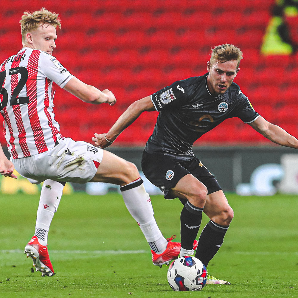 Photograph of Ollie Cooper playing against Stoke City
