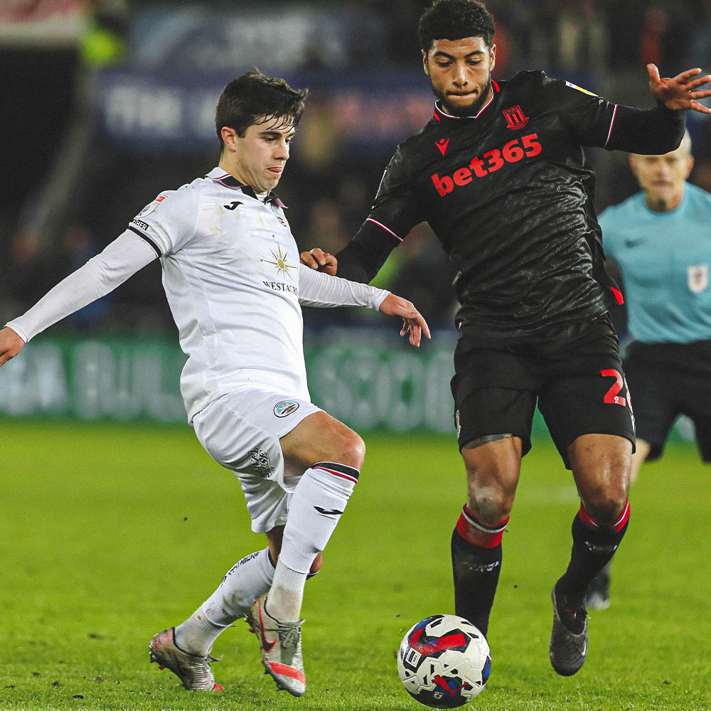 Walsh makes a tackle in his return against stoke