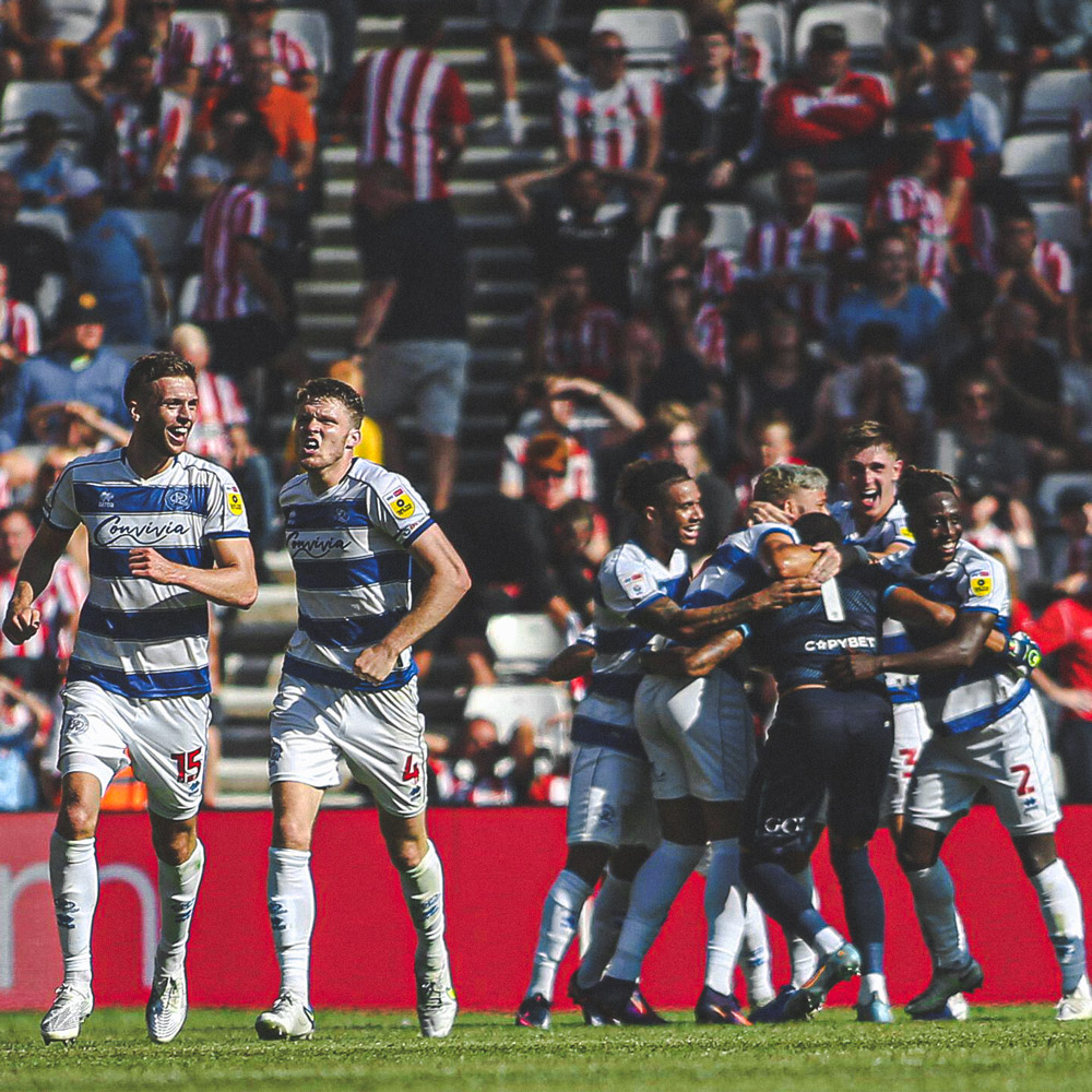 QPR squad celebrating scoring at The Stadium of Light