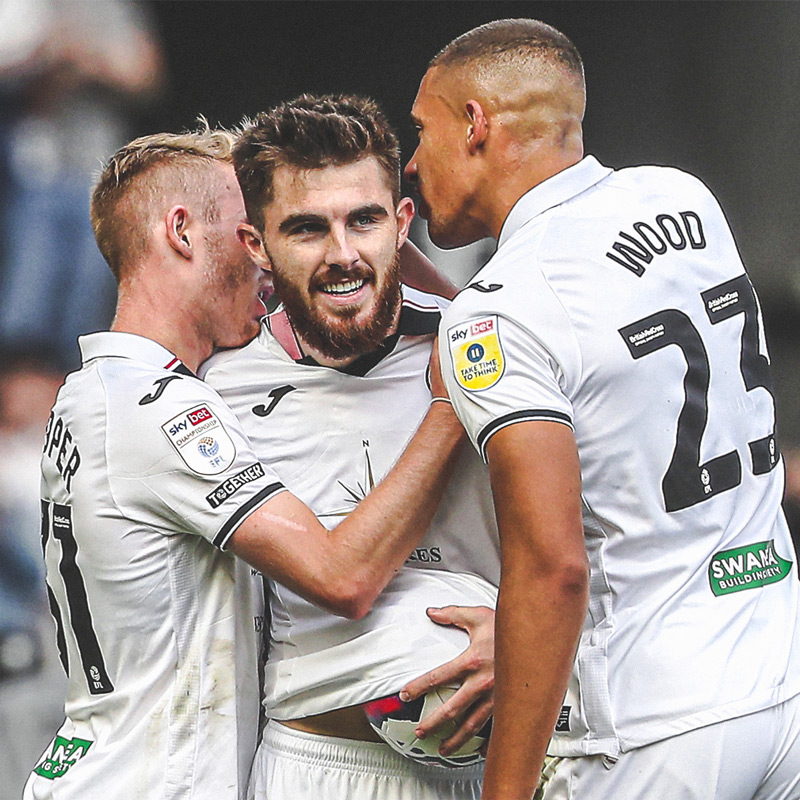 Manning celebrates scoring against Hull City at Swansea.com Stadium