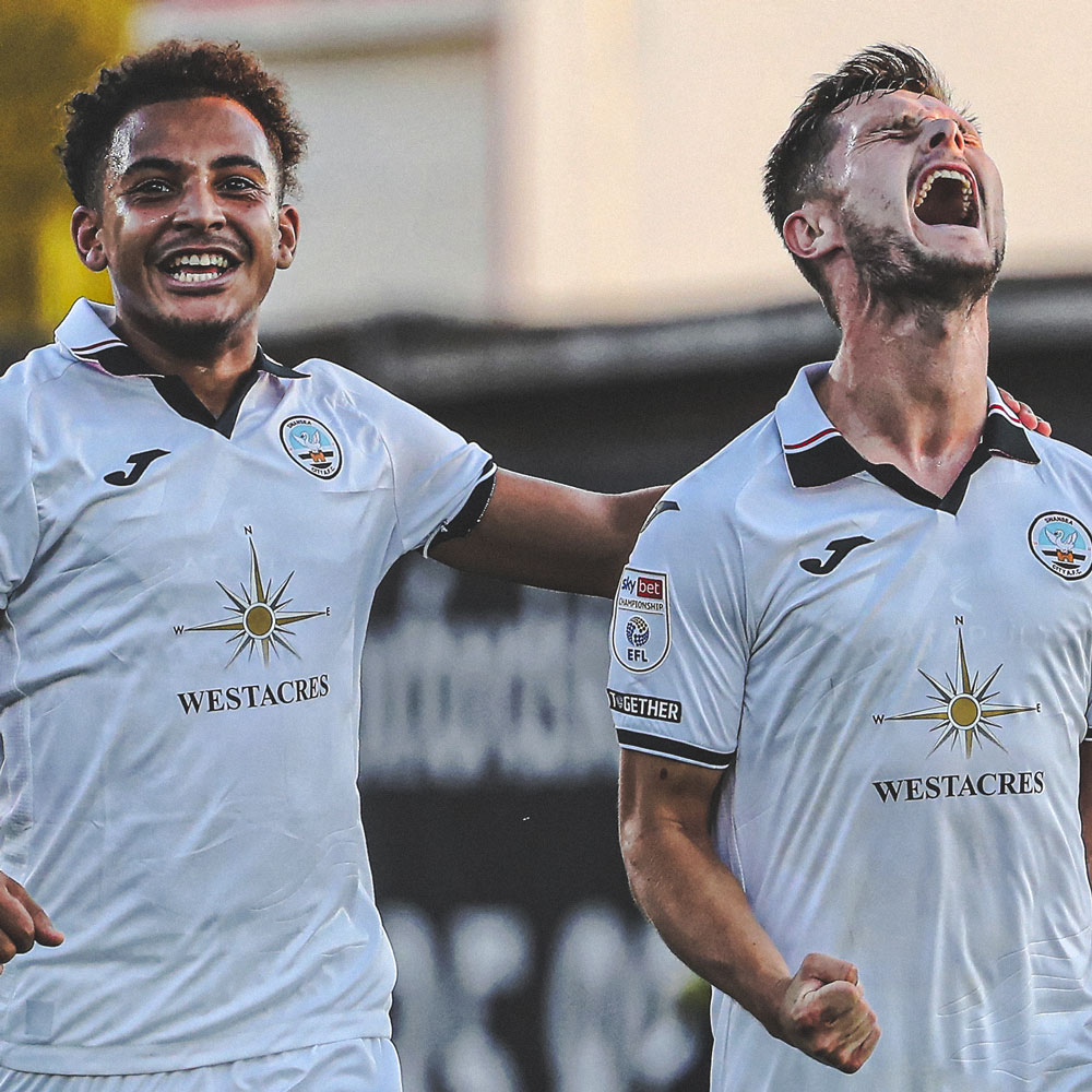 Sorinola celebrating with Liam Cullen against Oxford United