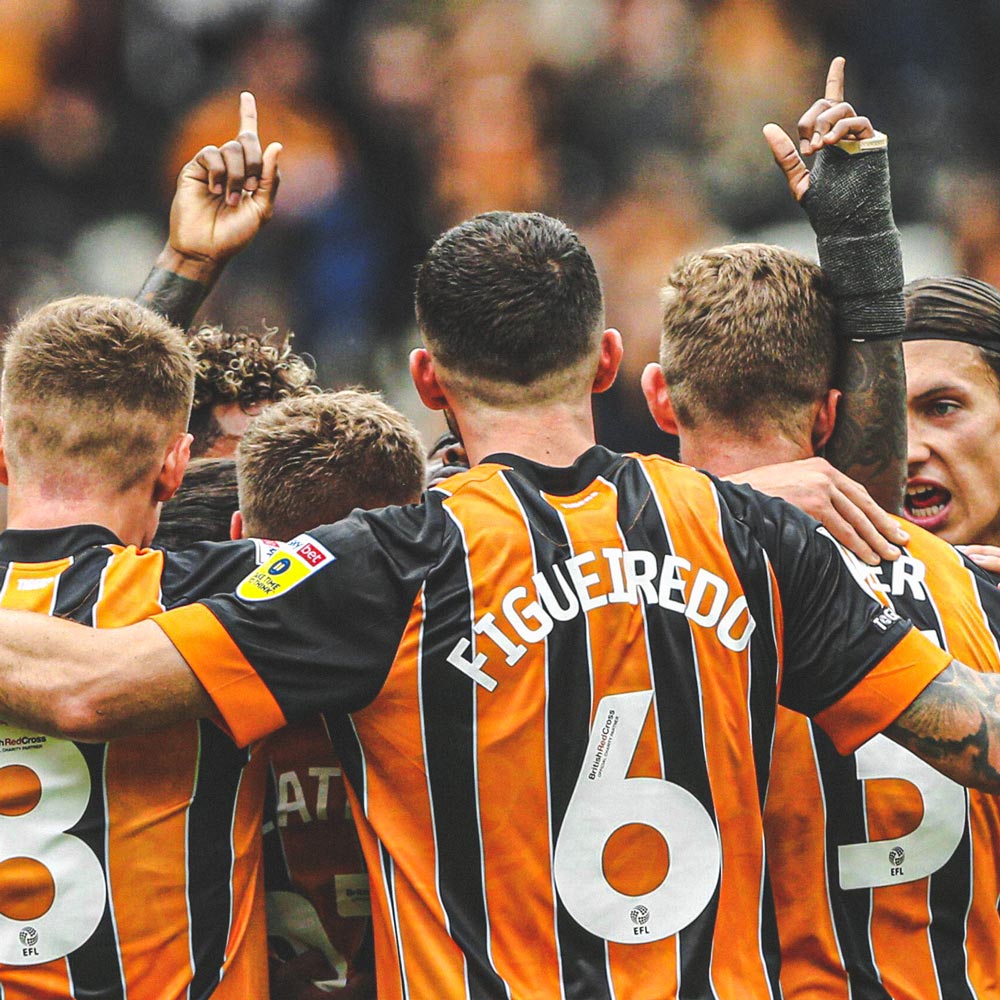 Sheffield United squad celebrating scoring at the MKM Stadium