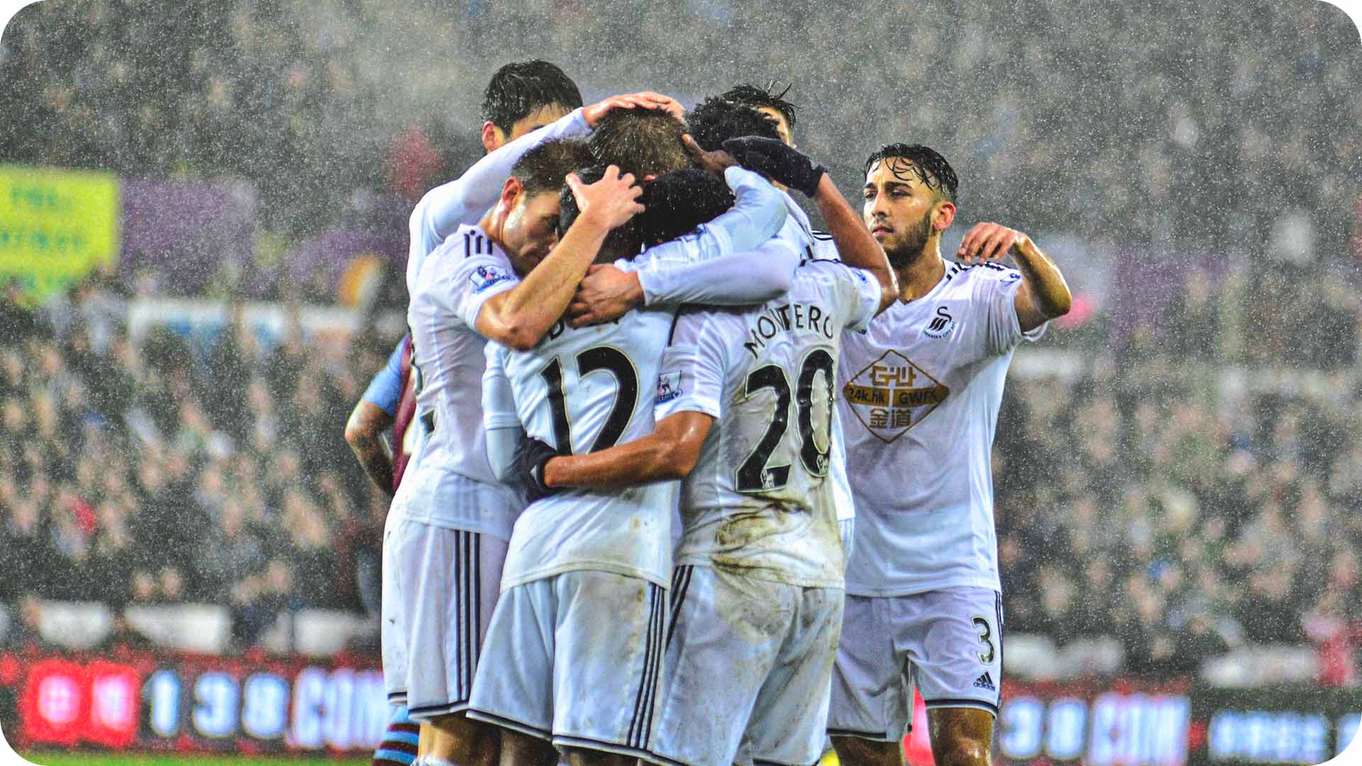 Photograph of the team celebrating scoring against Arsenal