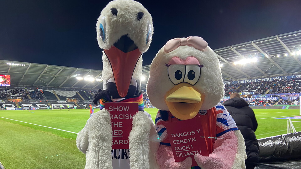 Cyril and Cybil hold show racism the red card cards