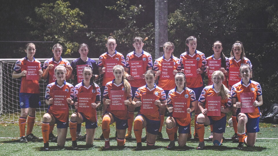 Swansea City Ladies U19 team photo with Show Racism the Red Card cards