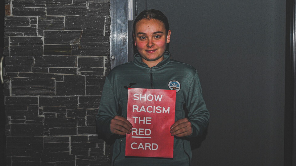 Ladies U19 player with Show Racism the Red Card cards