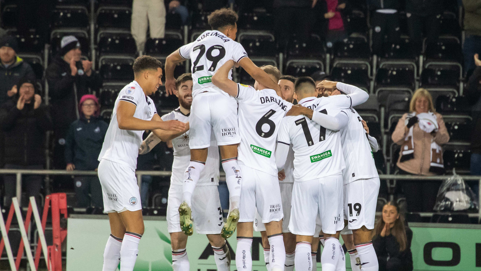 Players celebrate Morgan Whittaker's goal