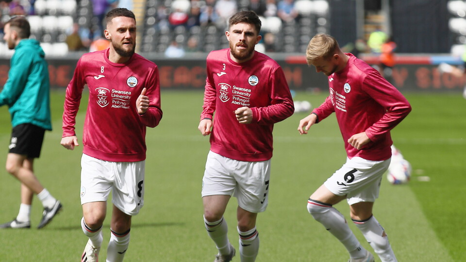 Matt Grimes and Ryan Manning warming up.
