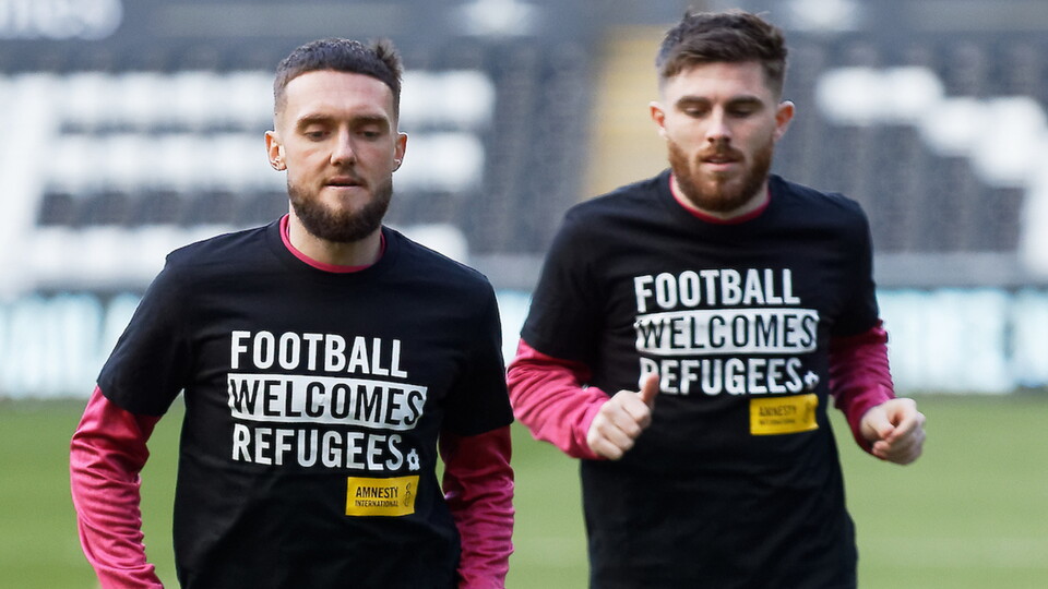 (L-R) Matt Grimes and Ryan Manning warming up.
