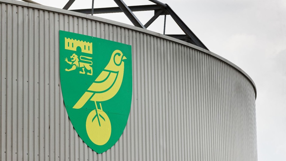 Photo of the Norwich City badge outside Carrow Road