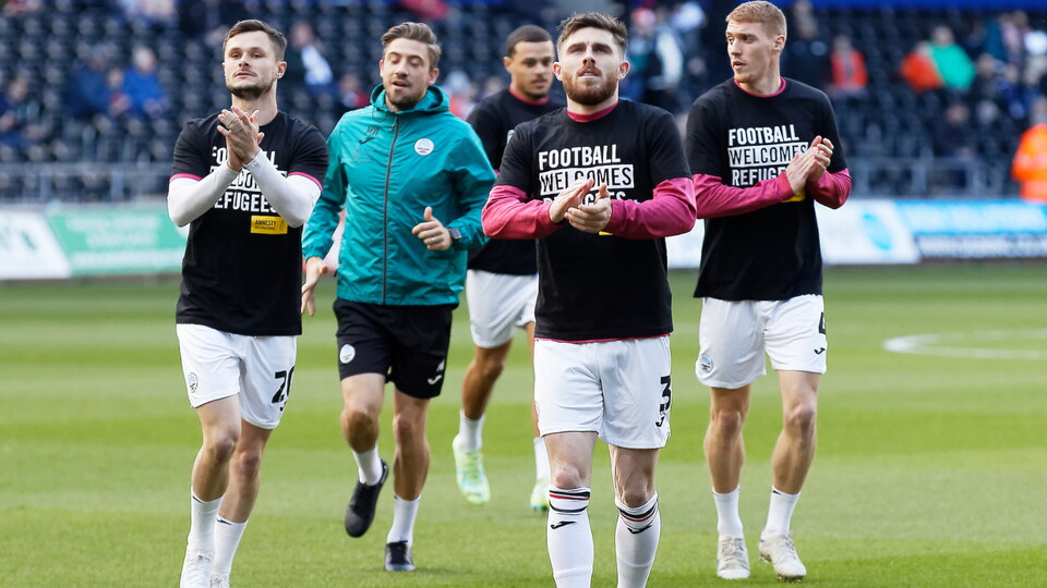 (L-R) Liam Cullen, Ryan Manning and Jay Fulton warming up. 