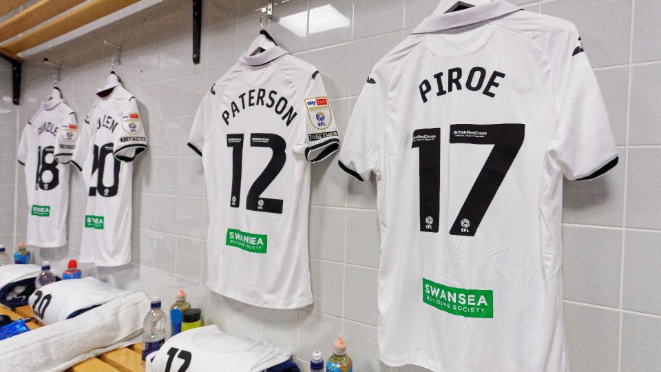 Joel Piroe and Jamie Paterson shirts hang in the changing room at Hull City.
