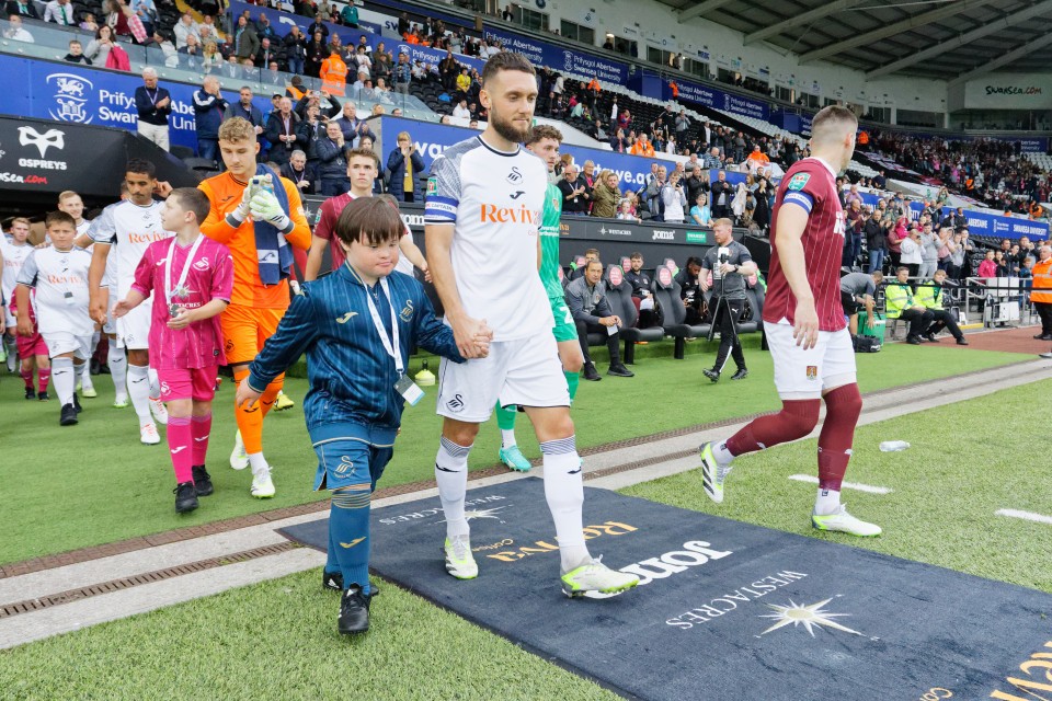 Matt Grimes mascot walk out 