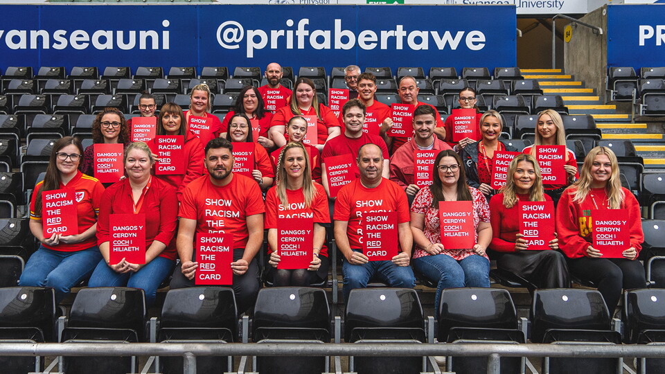 Swans staff show support for Show Racism the Red Card