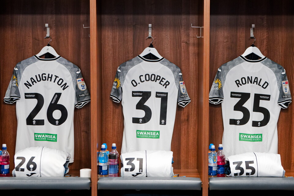 Naughton, Cooper and Ronald shirts hanging up 
