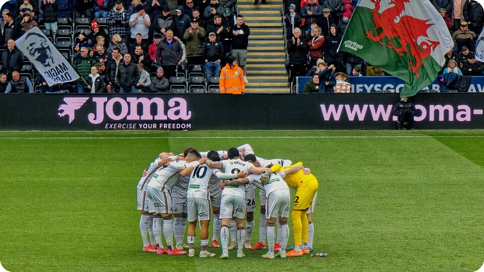 Swansea City in a huddle