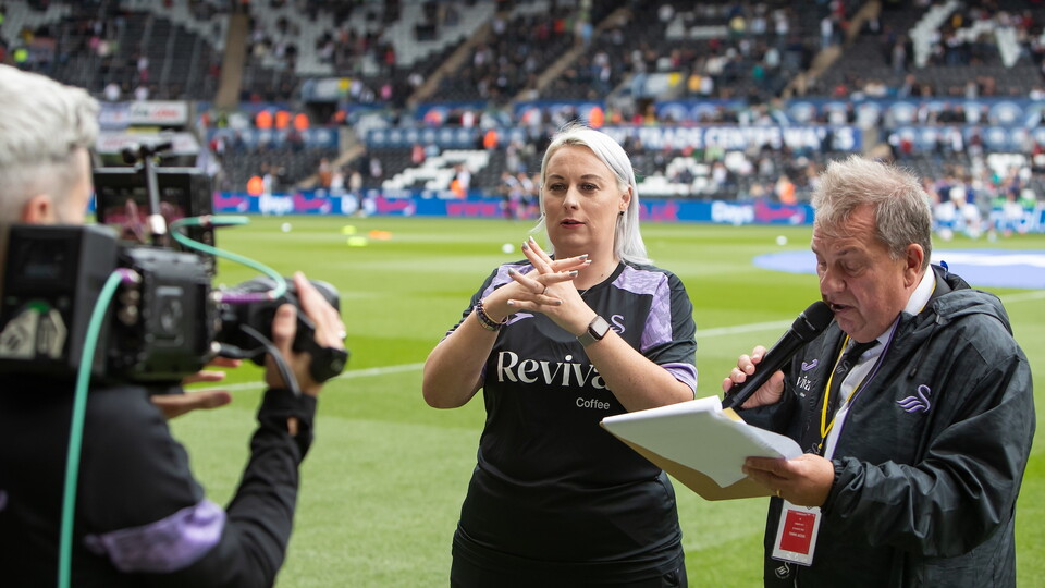 Talina and Kev pitchside