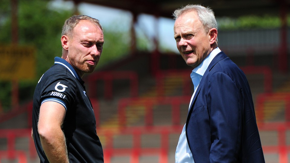 Head coach Steve Cooper speaks with chairman Trevor Birch.