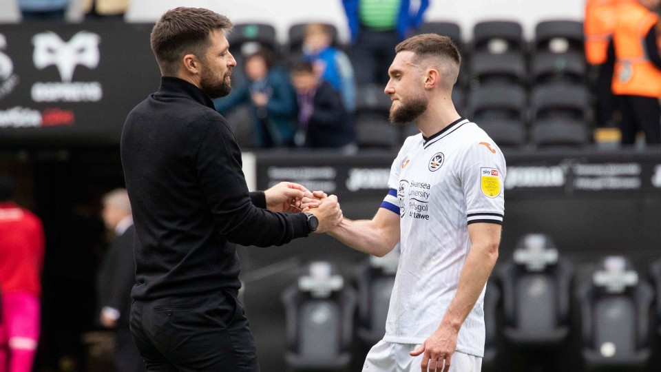 Russell Martin shakes Matt Grimes hand