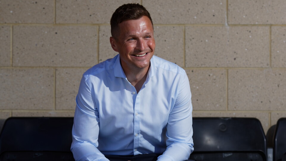 Andy Goldie sits in the stand seats at Fairwood Training Ground