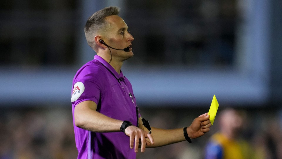 James Bell issues a yellow card