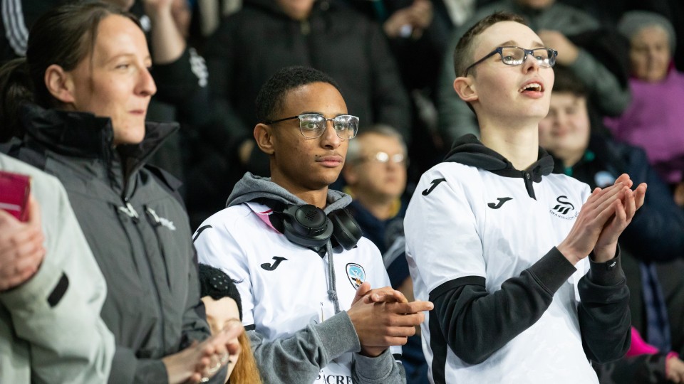 Swans fans cheer on the team against Watford