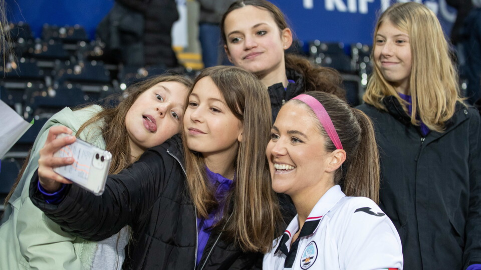 Emma Beynon poses for a selfie with fans