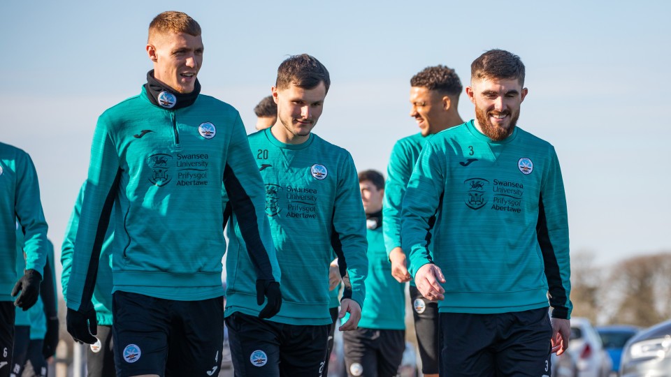 Jay Fulton, Liam Cullen, and Ryan Manning talking as they walk to training