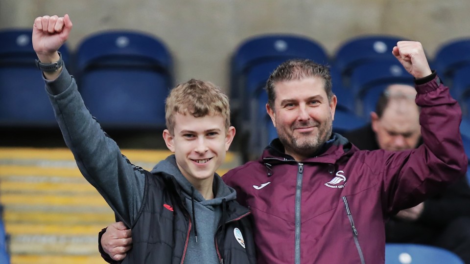 Two fans at Blackburn Rovers away