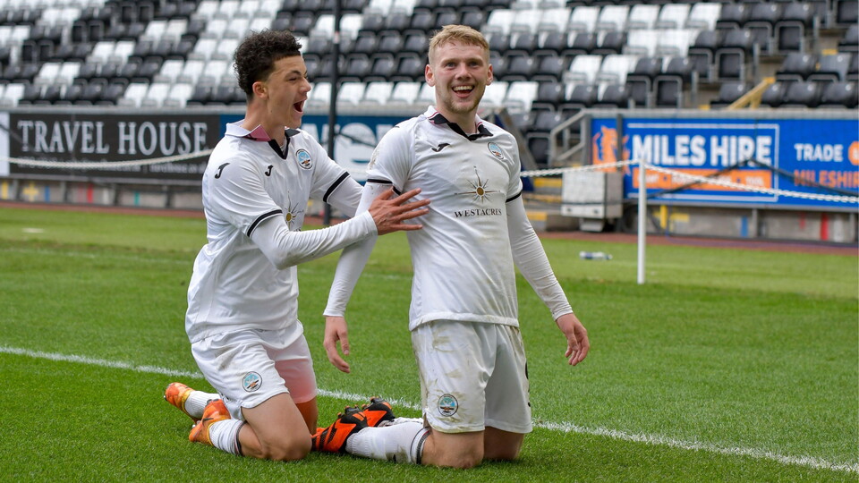 Filip Lissah celebrates with goalscorer Josh Thomas