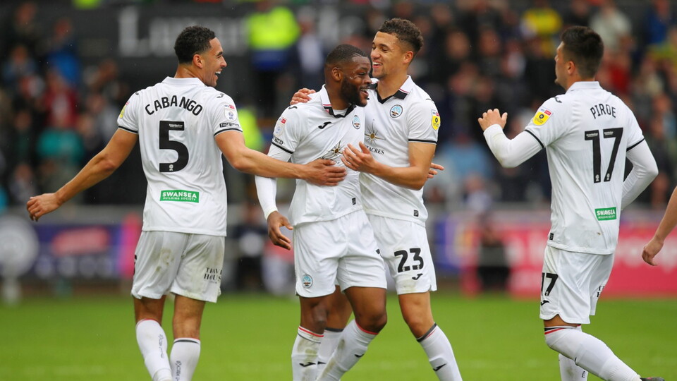 Olivier Ntcham celebrates with team-mates.