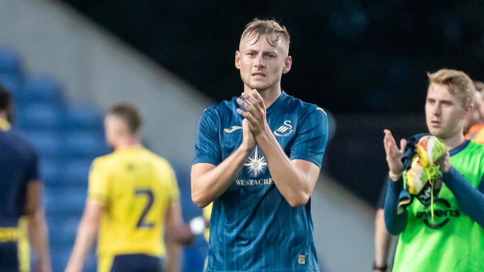 Harry Darling applauds fans at Oxford
