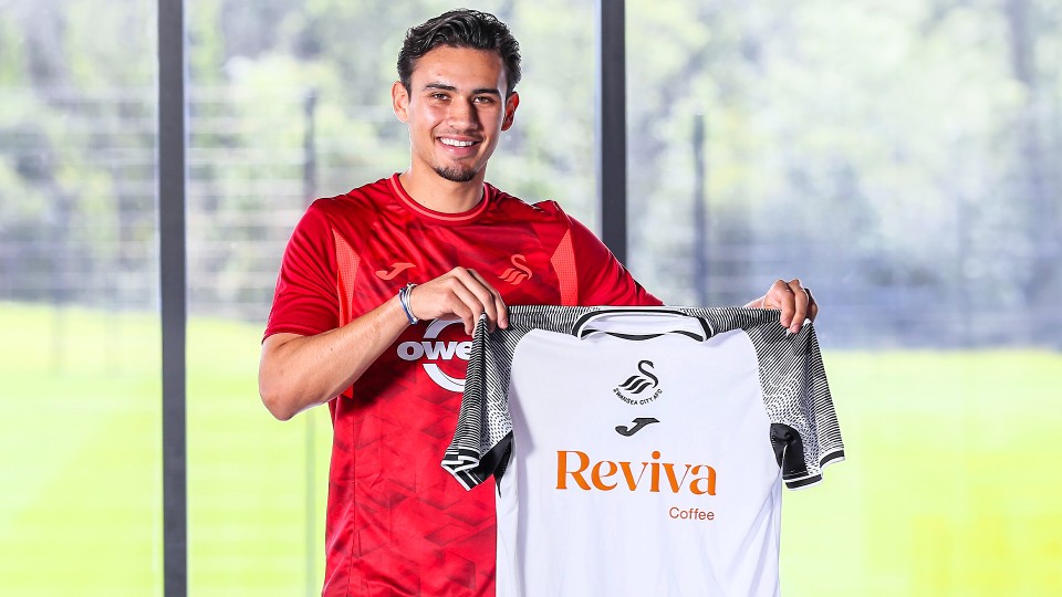 Nathan Tjoe-A-On holds up the home shirt