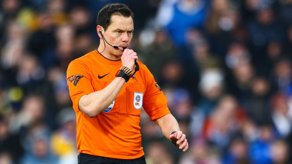 Darren England blows his whistle