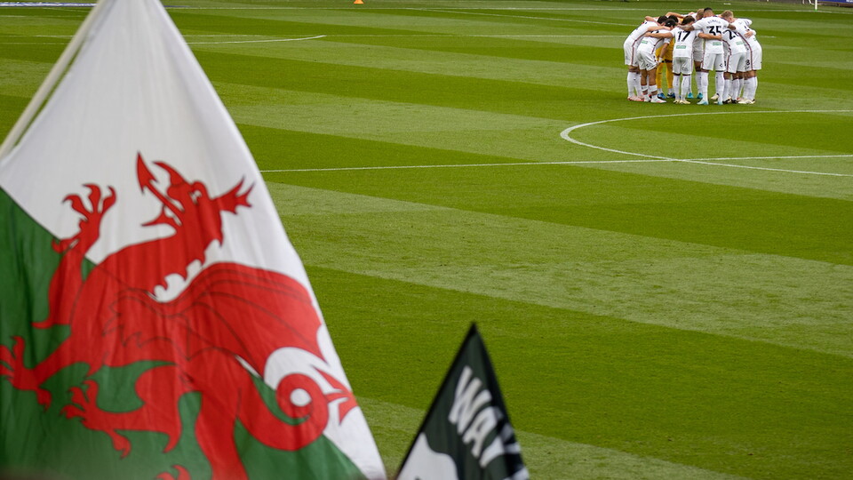 Swansea City players huddle at the Swansea.com Stadium